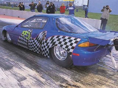 0107tur_15z+mazda_mx3+left_rear_view.jpg